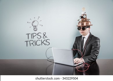 Tips And Tricks Concept With Vintage Businessman And Laptop At Office