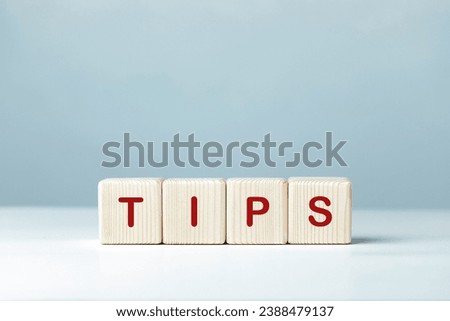 Tips word written on wooden cubes.