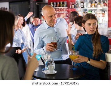 Tipsy Man Trying To Seduce Young Female Colleague On Office Party At Nightclub

