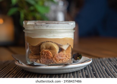 Tiramisu With Banana In Transparent Glass.