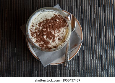 Tiramisu With Banana In Transparent Glass.