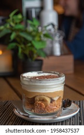 Tiramisu With Banana In Transparent Glass.