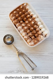 Tiramisu Ice Cream In Plastic Box With Spoon For Ice Cream, Overhead. Top View, From Above.