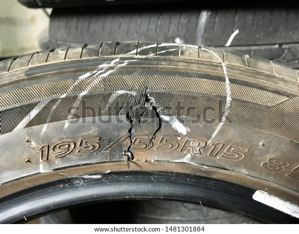 Tire burst. Broken tire. Damaged tire after\
tire explosion at high speed on\
highway.