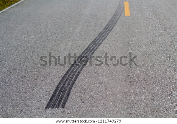 Tire marks on the road, sudden stops, road\
accidents, burn marks