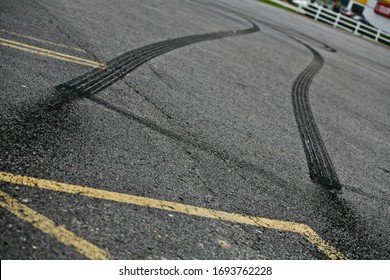 Tire marks from a parking lot burnout.