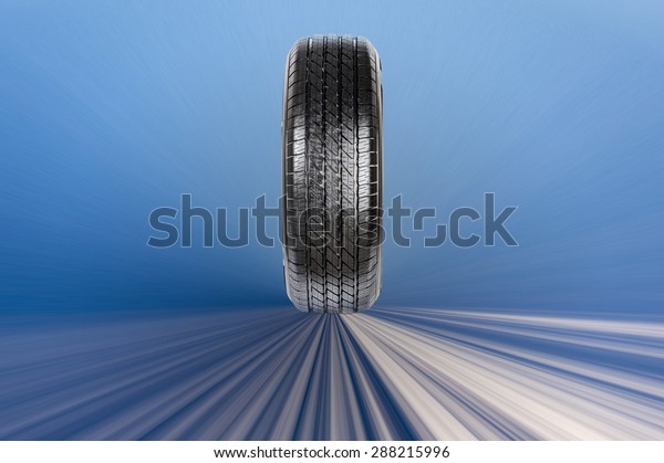 Tire on blue background,\
free space.