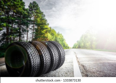 Tire on summer road. 