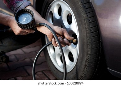 Tire Pressure Check By Car Mechanic Outdoor