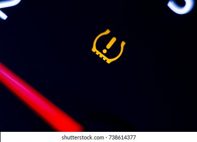 Tire pressure warning light illuminated.  - Shutterstock ID 738614377