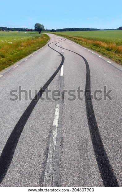 Tire print on the asphalt\
road