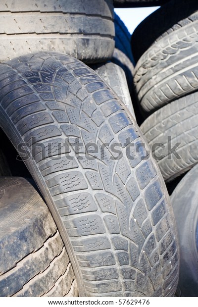 Tire recycling,\
landfill with old tires