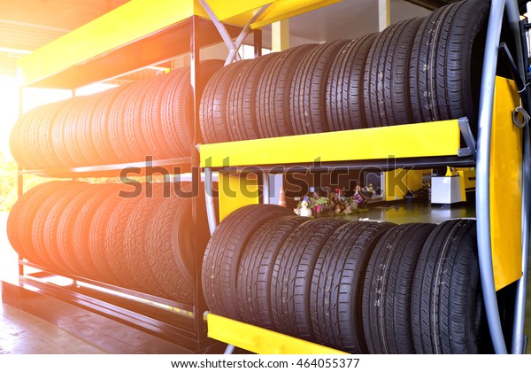 Tire rubber products , Group of new tires for sale\
at a tire store.