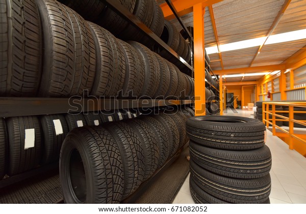 Tire rubber products , Group of new tires for sale\
at a tire store.