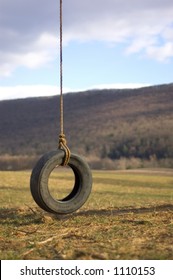 Tire Swing Hanging From the Sky