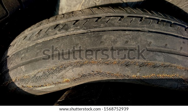 Tire texture damaged by\
usage