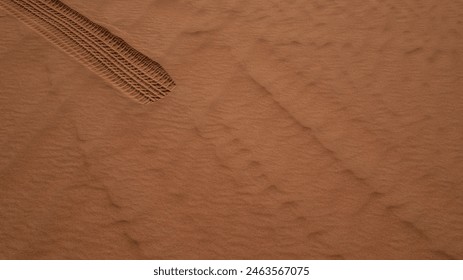 Tire Track Imprint on Desert Sand