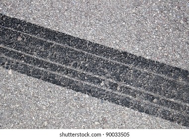 Tire Track On The Asphalt