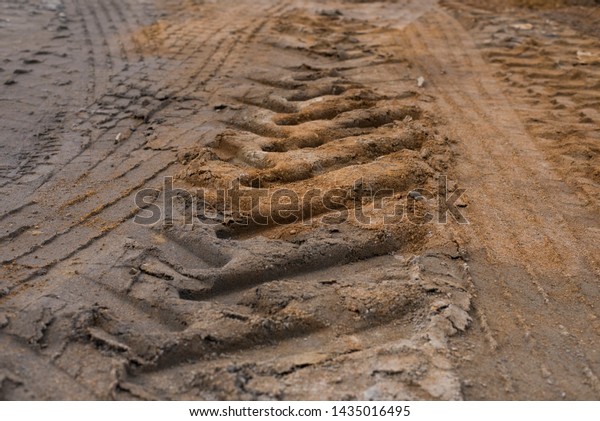 Tire tracks on mud
background