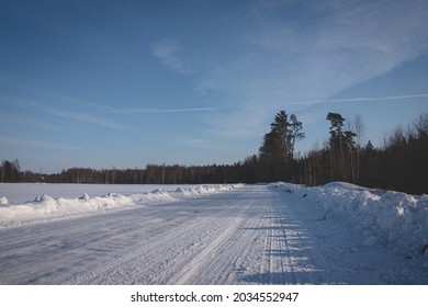 Tire Tracks In The Snow, Winter Road, Empty Road In Winter Bends, Covered With Snow Path, Winter Landscape	