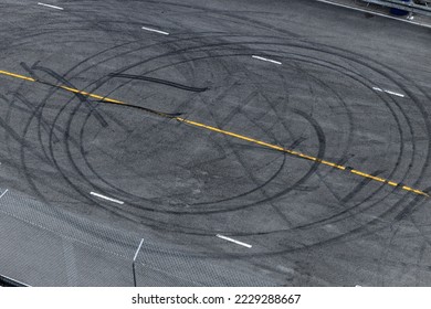 Tire tracks texture and background, Asphalt texture with line and tire marks, Automobile automotive tire skid mark on race track, Abstract texture car drift tire skid mark. - Shutterstock ID 2229288667