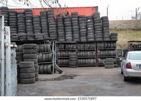 tire warehouse and parked\
car