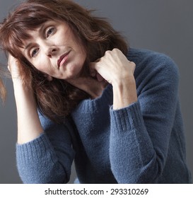 Tired 50's Woman Holding Her Head And Hair For Depression, Loss Or Fatigue Due To Menopause