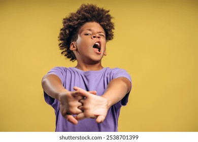 Tired, African American boy with stylish hairstyle yawning, stretching hands wakeup, standing isolated on yellow background. Morning routine concept - Powered by Shutterstock