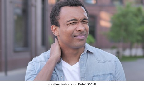 Tired African Man with Neck Pain