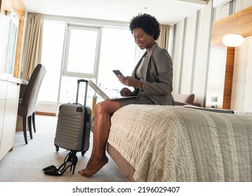 Tired African-American businesswoman are finally arrives in the hotel room after all day discussing and talking at the conventions and seminars.	
 - Shutterstock ID 2196029407