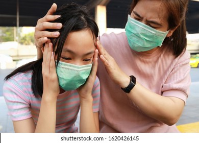 Tired Asian Child Girl Crying With Hygienic Mask Suffer From Headache And Air Pollution,allergy To Dust,feel Sick,dizzy,people Wearing Face Mask Protection,dirty Air Prevent PM2.5 In City Bangkok