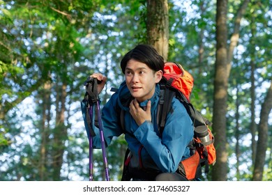 Tired Asian Climber In The Mountain