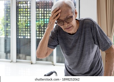 Tired Asian Senior Woman Touch Her Head With Hand,symptoms Of Vertigo Illness Or Meniere’s Disease Affecting Inner Ear,feel Unwell Faint,giddiness,loss Of Balance While Walking,old Elderly With Dizzy