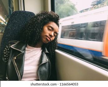 Tired Black Woman Sleeping On The Train