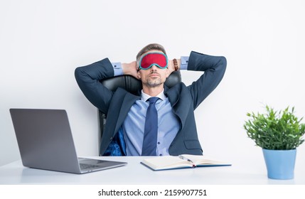Tired Boss Relax In Sleep Mask At Workplace