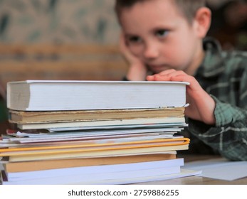 Tired Boy Looking Away from Stack of Books with Exhausted Expression — Child Study Fatigue, Mental Overload, Learning Burnout and Overwhelm Concept