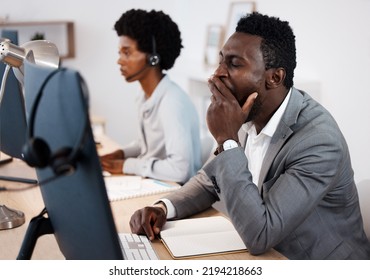 Tired, Burnout And Exhausted Business Man, Overworked Sleepy And Yawning In His Call Center Office At Work. Exhaustion And Tiredness With A Customer Support Agent Or Sales Agent Sitting At His Desk