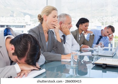 Tired Business Team At Conference In The Office