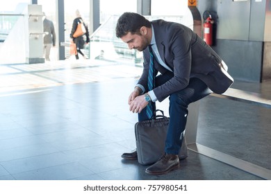 Tired Businessman Commuter Is Traveling And Is Waiting Alone