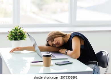 Tired Businesswoman Sleeping On The Desk, In Front Of The Computer Screen.