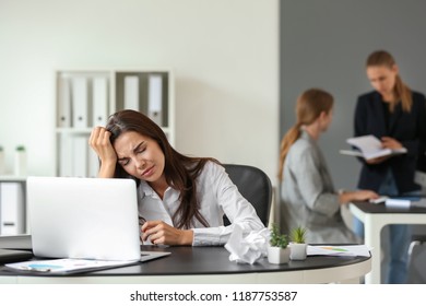 Tired businesswoman working in office - Shutterstock ID 1187753587