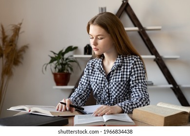 Tired Caucasian Girl Student Consultant Or Teacher Preparing For A Lecture By Reading Several Books Of Encyclopedia Reference Books, Studying The Material. Online Education, Distance Learning Concept.