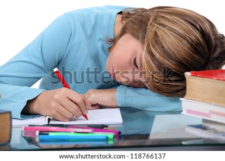 Tired child doing homework