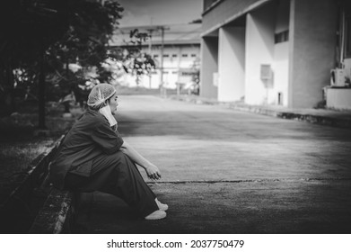 Tired Depressed Female Asian Scrub Nurse Wears Face Mask Blue Uniform Sits On Hospital Floor,Young Woman Doctor Stressed From Hard Work