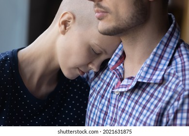 Tired Depressed Young Hairless Ill Woman Exhausted With Cancer Treatment, Chemotherapy, Leaning Hugging Husband, Leaning Head On Male Shoulder, Getting Love, Support, Empathy. Close Up