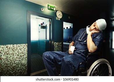 Tired Doctor Sleeping In A Wheelchair