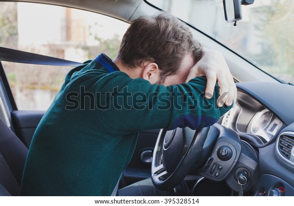 tired driver in the\
car