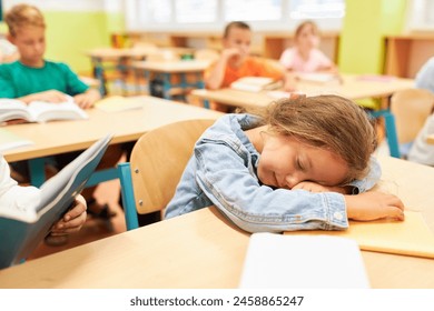 Tired elementary schoolgirl sleeping on bench in classroom - Powered by Shutterstock