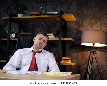 Tired Employee Sleeps At The Workplace. Burnout And Exhaustion Concept.