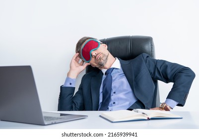 Tired Employer Relax In Sleep Mask At Workplace